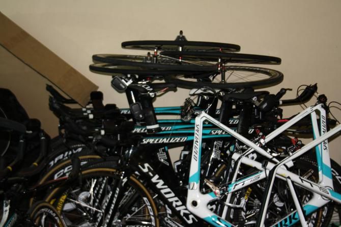 Time trial bikes for the coming season sit buried under wheels and frames