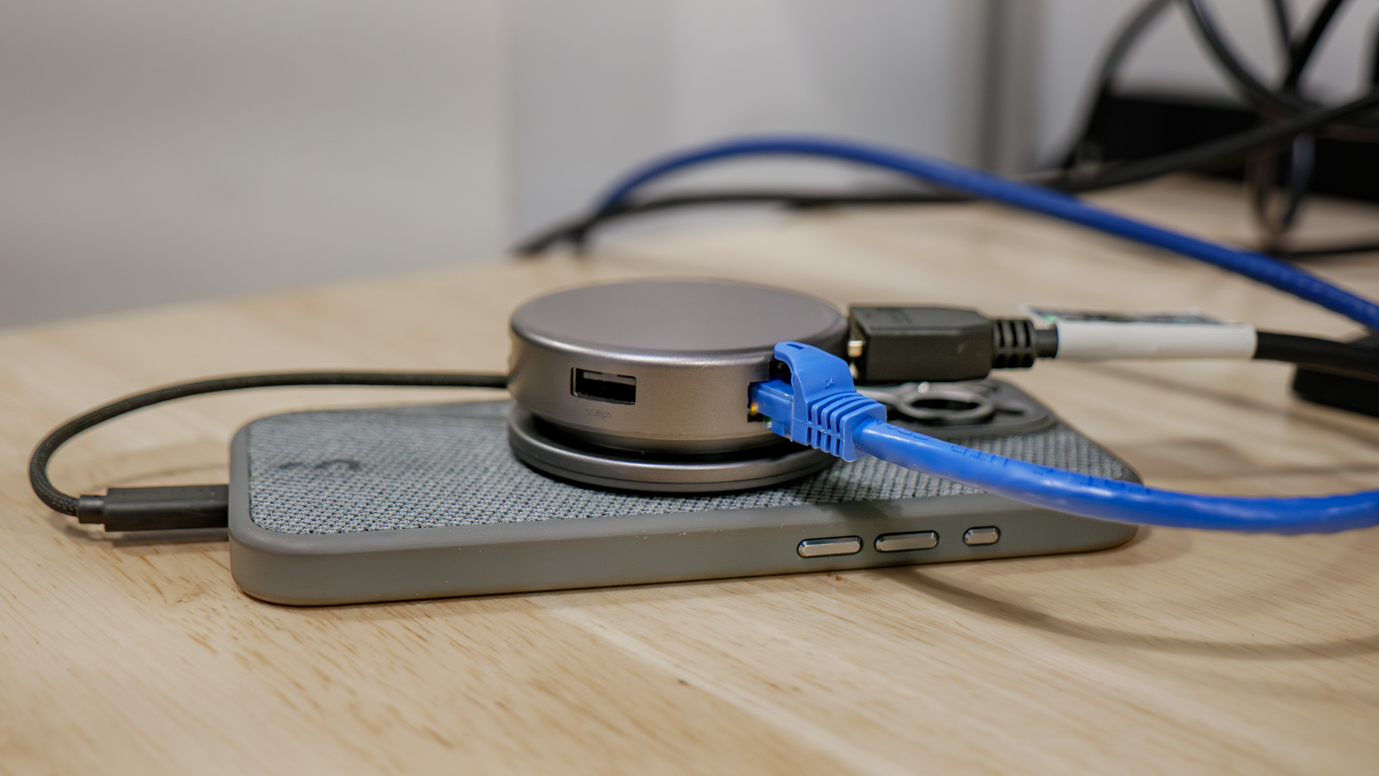 Satechi OntheGo 7-in-1 Multiport Adapter connected to iPhone and ethernet.