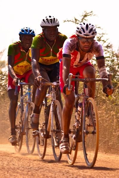 Augustin and Soglo draft a French rider on stage nine&rsquo;s gravel section.