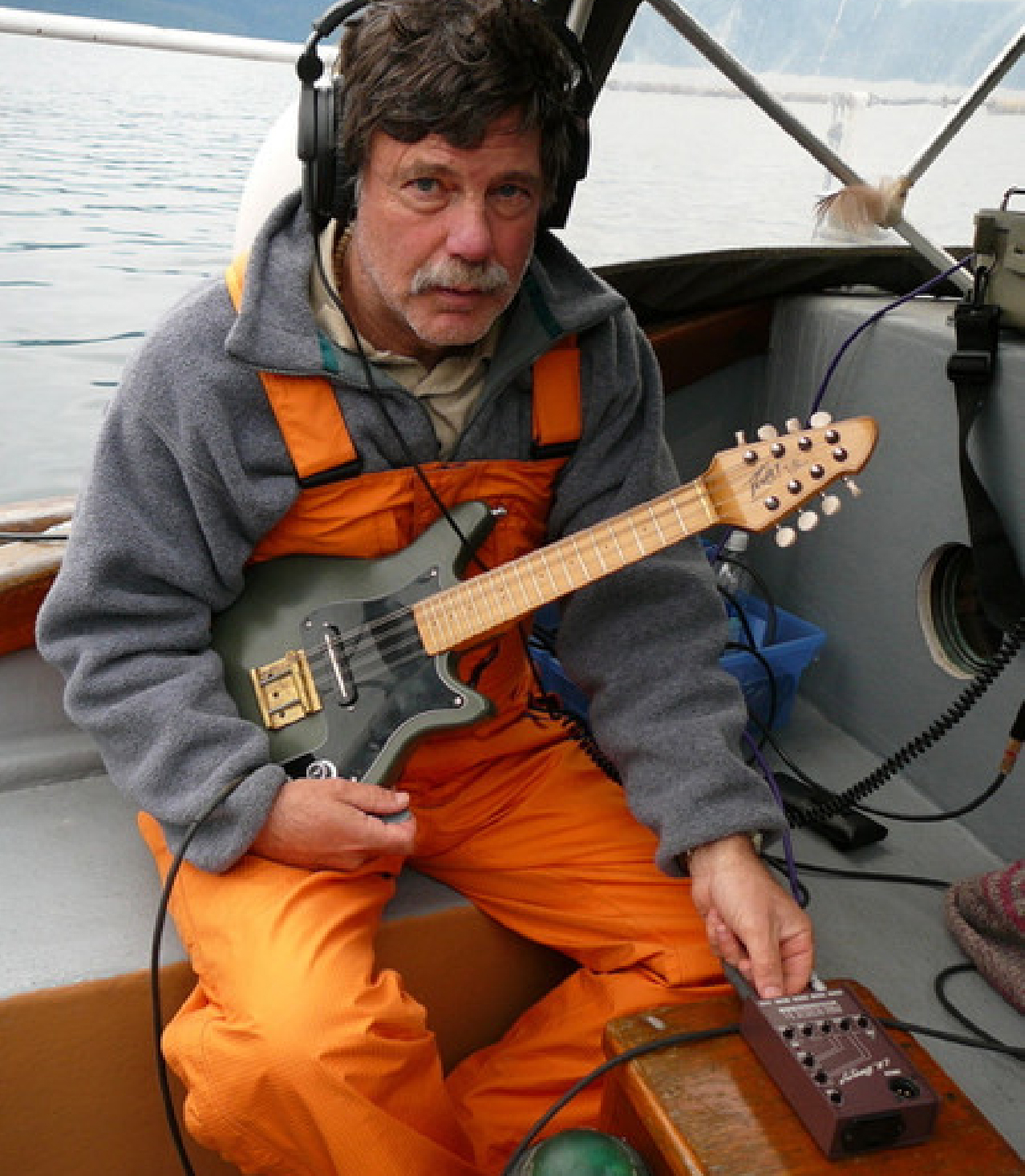 Jim Nollman with a custom-built electric mandolin given to him by Hartley Peavey of the Peavey Guitar Company