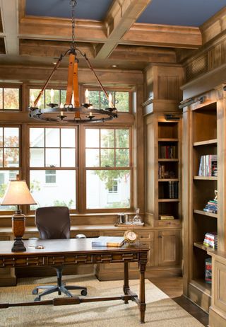 wood lined farmhouse home office with blue painted ceiling, coffered wooden ceiling