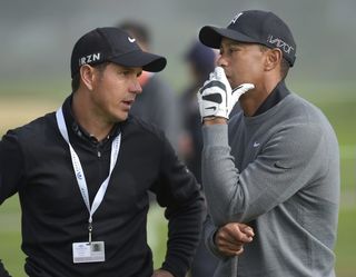 Tiger Woods and coach Chris Como