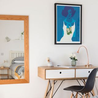 exterior of scandi house dressing area with copper lamp chair and table
