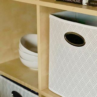 wooden shelves with fabric storage basket