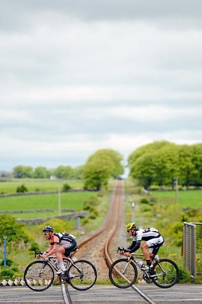 Philip Lavery (Node4 Giordana), left, and Scott Creighton (New Zealand) go over a level crossing at Ardrahan.