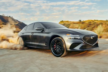 Genesis G70 car, exterior shot of vehicle in natural terrain