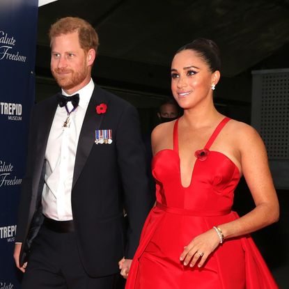 Prince Harry and Meghan Markle in black tie at a gala