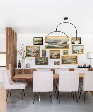 Dining room with modern furniture and traditional gallery wall
