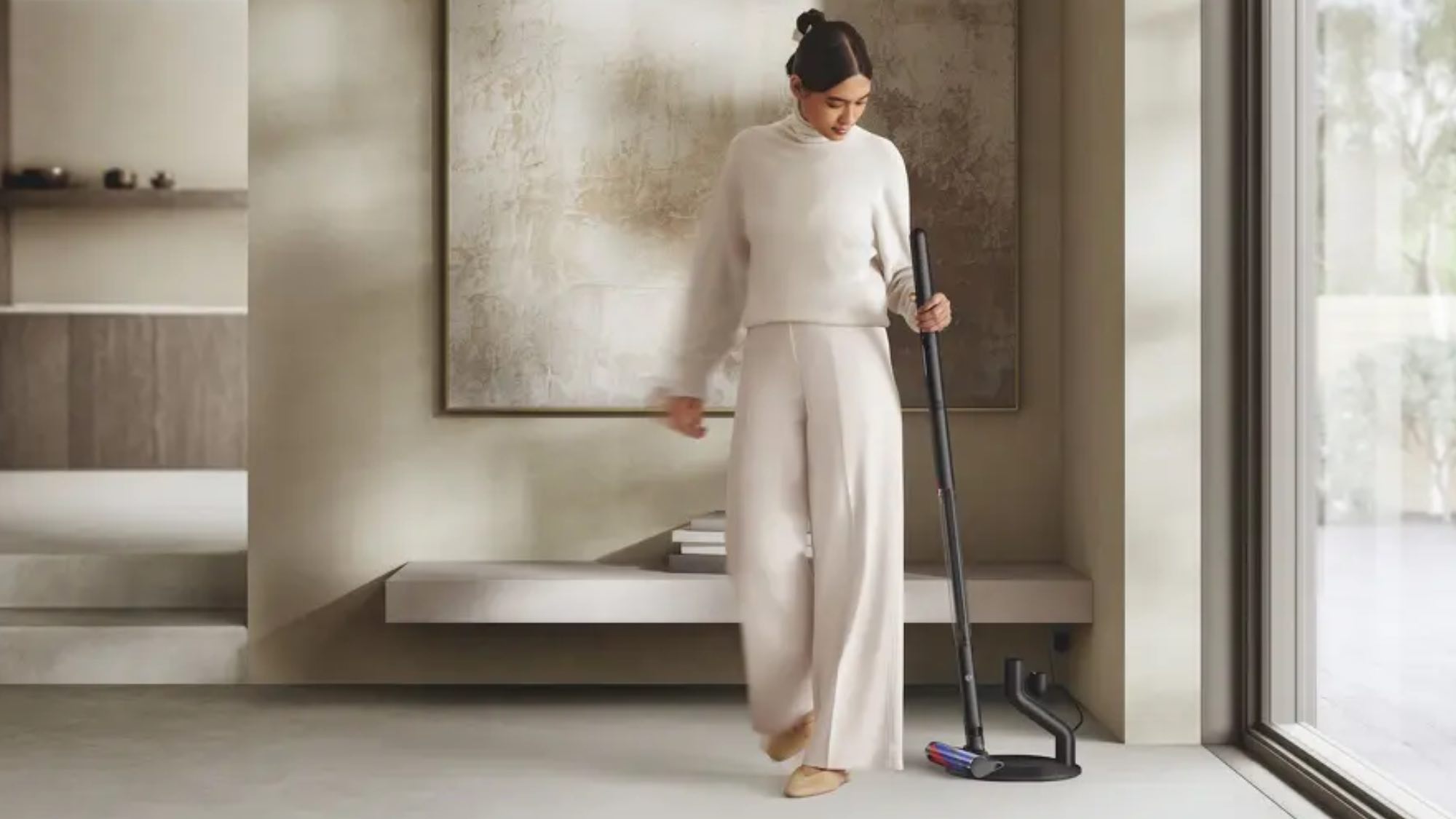 woman holding Dyson PencilVac Fluffy