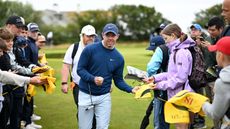 rory mcilroy signing flags at the 2024 open championship