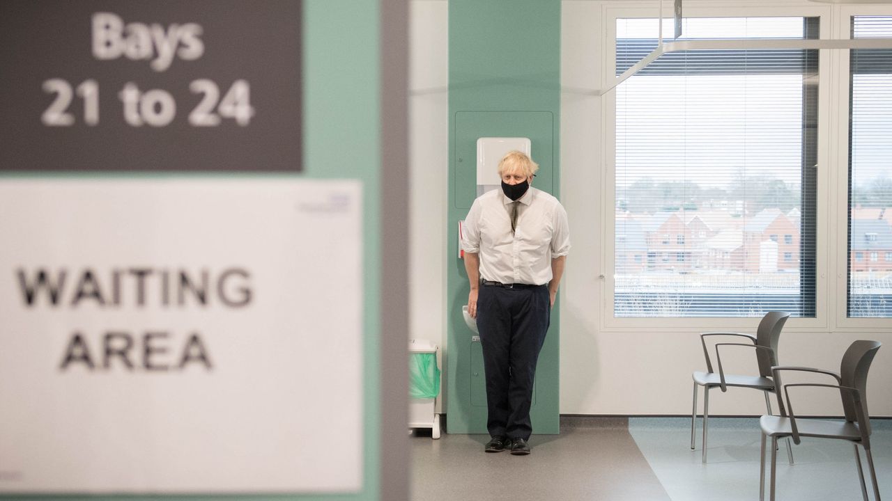 Boris Johnson during a visit to view the vaccination programme at Chase Farm Hospital.