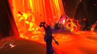 WoW Blazing Shadowflame chest - a shadow priest is standing in front of a lava fall with a chest sitting at the bottom