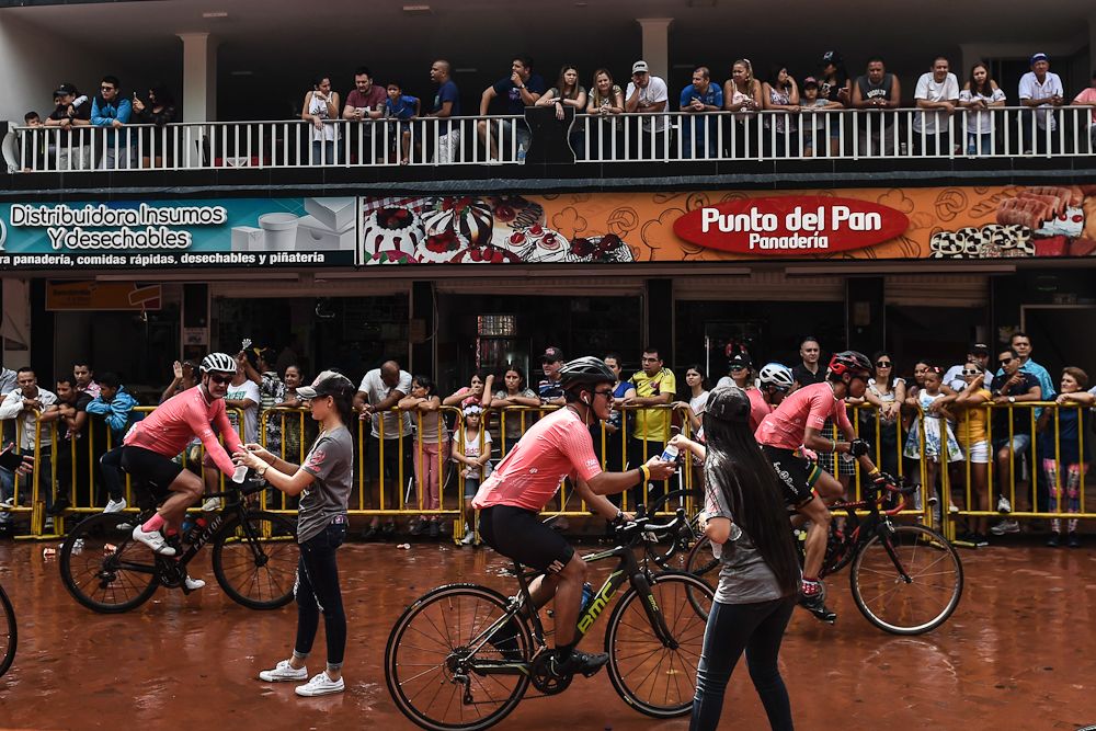 Riders in the Giro de Rigo get some refreshments