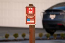 A sign marks the international boundary between Canada and the United States in Blaine, Washington, US, on Wednesday, Dec. 18, 2024. Canada's trade surplus with the US helped the northern nation avoid a deeper overall deficit, underscoring the importance of its biggest trading partner as President-elect Donald Trump threatens crippling tariffs