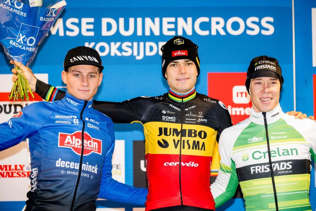 Dutch Mathieu Van Der Poel Belgian Wout Van Aert and Belgian Laurens Sweeck on the podium after the mens elite race at the Duinencross cyclocross cycling event on Thursday 05 January 2023 in Koksijde the fifth stage in the X2O Badkamers Trofee Veldrijden competition BELGA PHOTO JASPER JACOBS Photo by JASPER JACOBS BELGA MAG Belga via AFP Photo by JASPER JACOBSBELGA MAGAFP via Getty Images