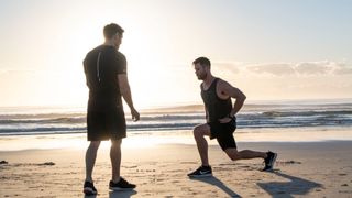 Chris Hemsworth exercising on the beach with his trainer Luke Zocchi