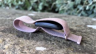 Garmin Cirqa worn on sunny day against stone background