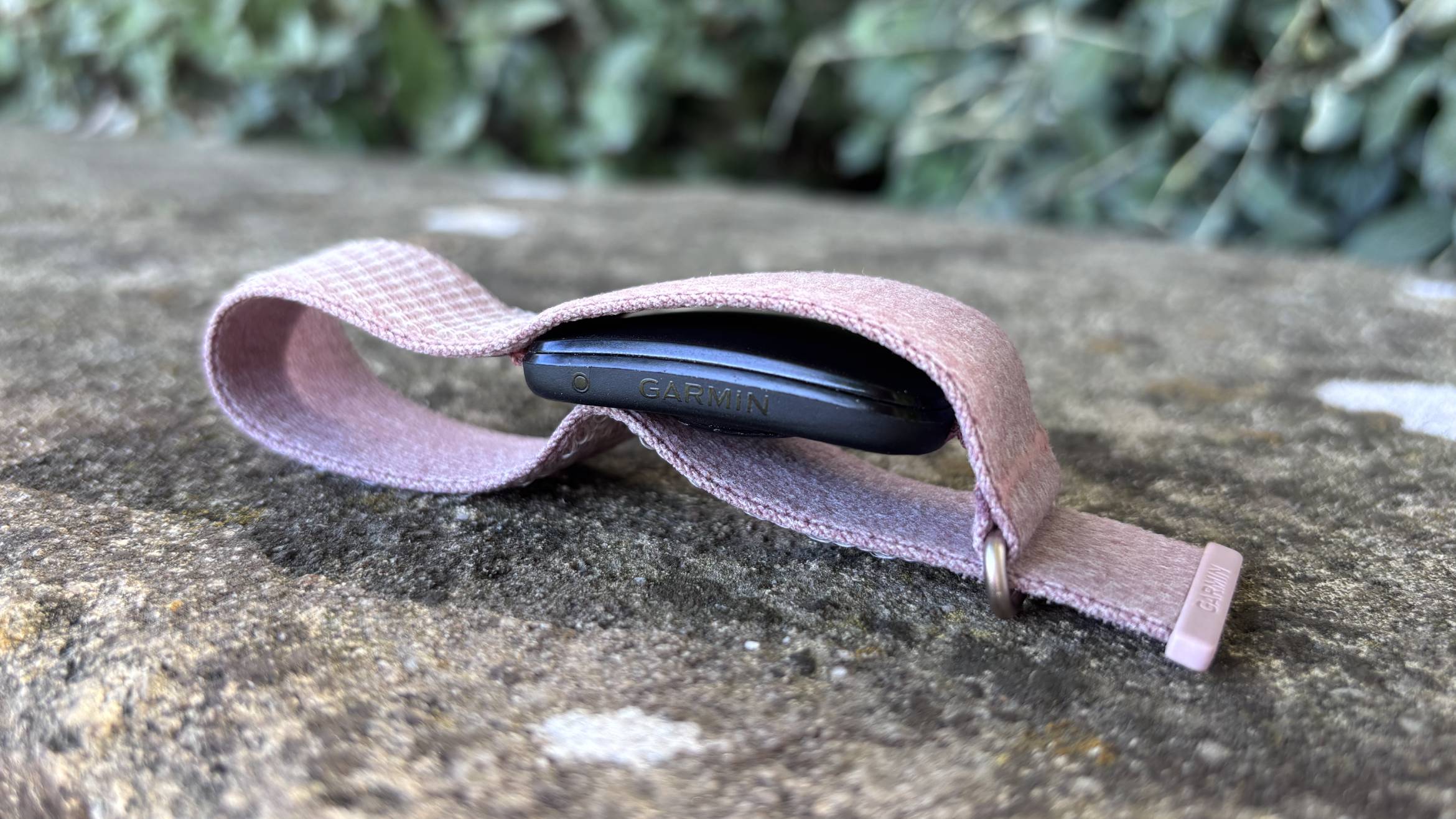 Garmin Cirqa worn on sunny day against stone background