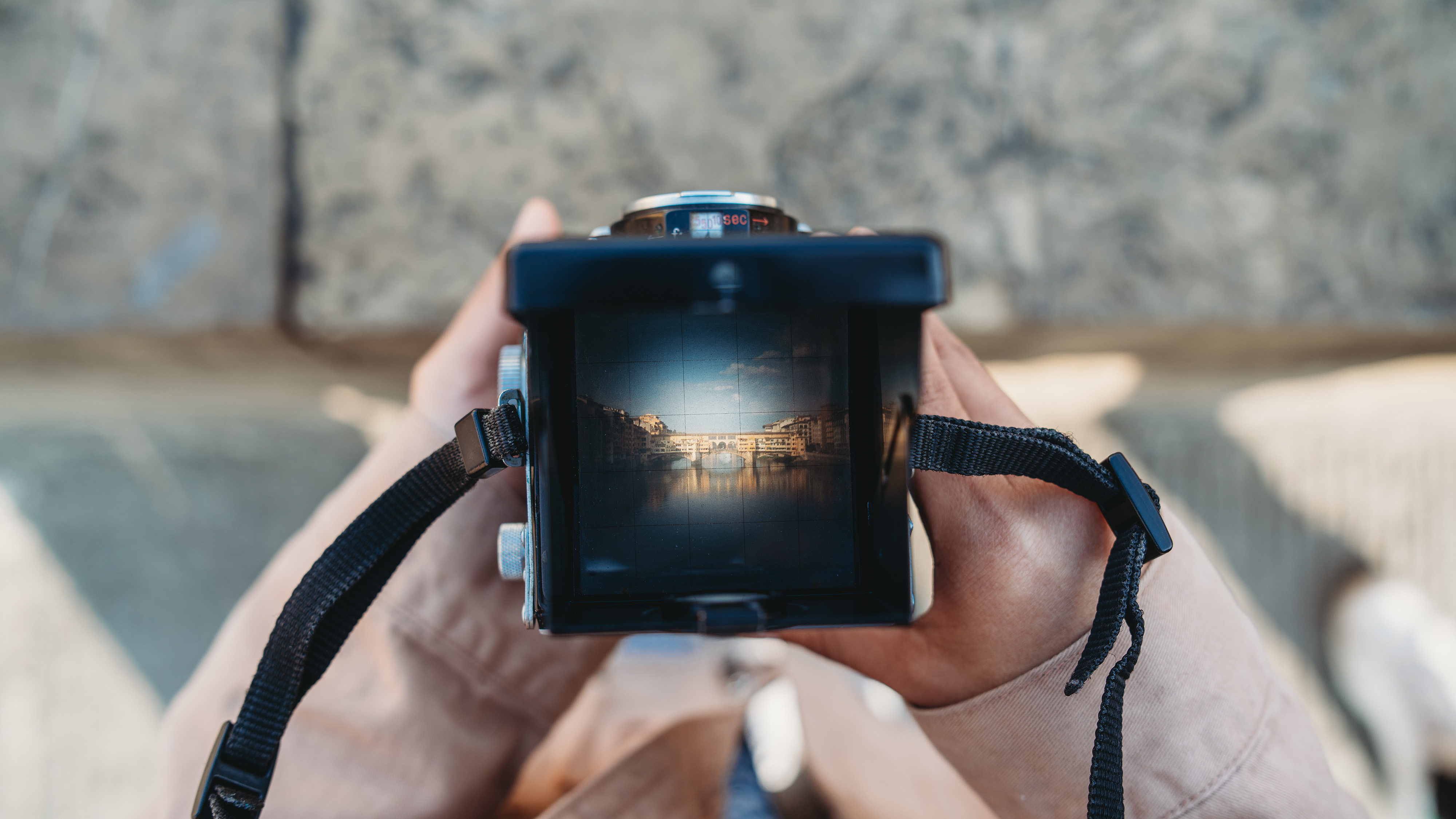 A retro film camera with a waist-level finder