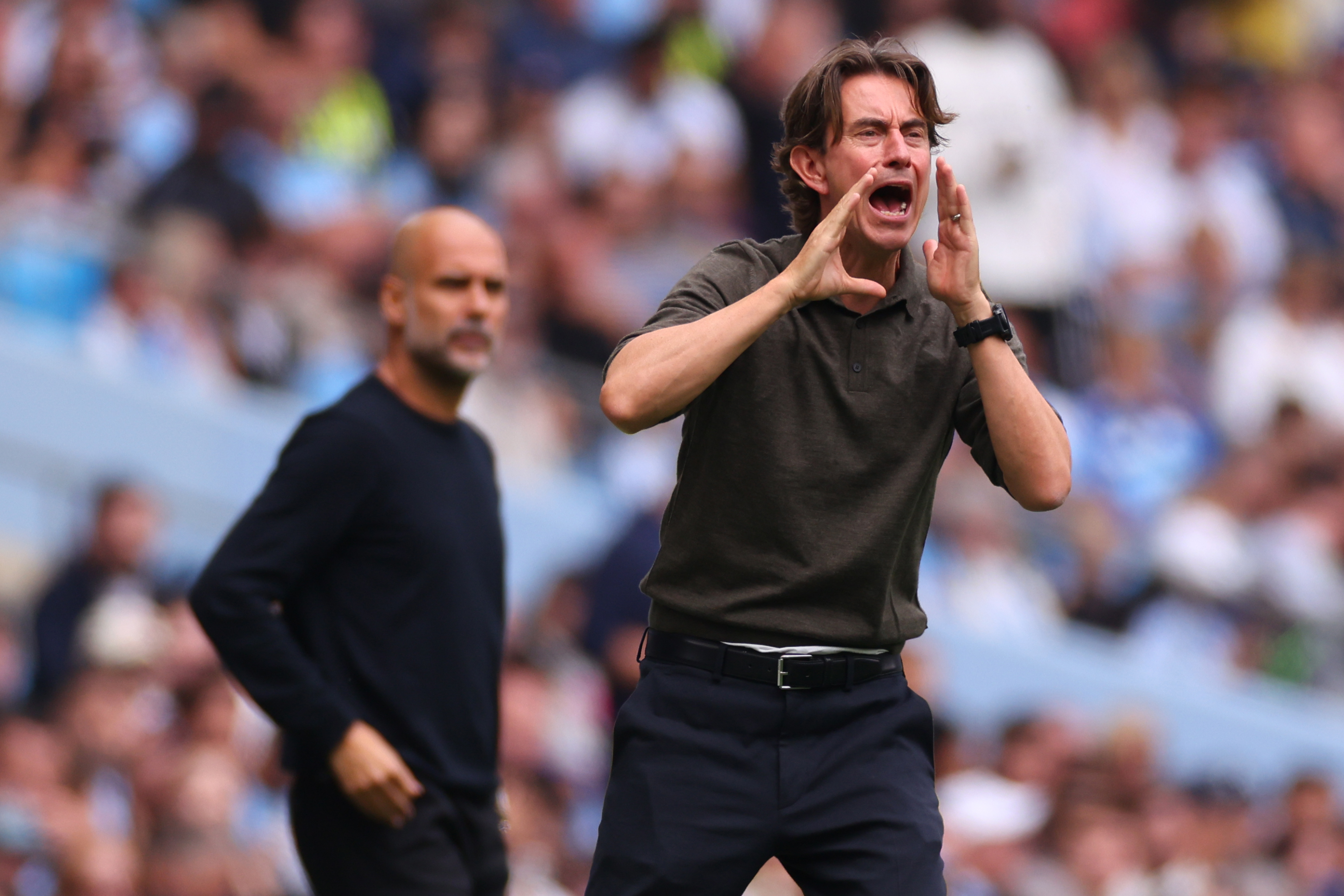 Thomas Frank yells instructions to his Spurs players