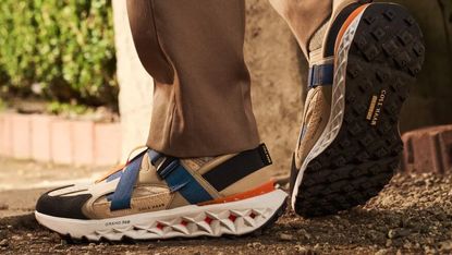 A man's feet in Cole Haan shoes