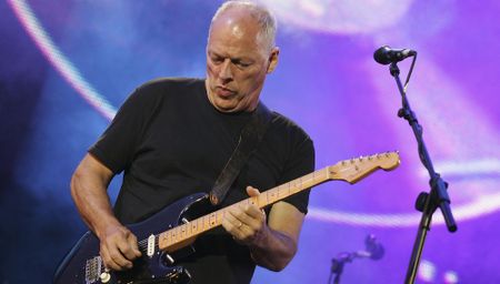 David Gilmour performs onstage with Pink Floyd in Hyde Park, London on July 2, 2005