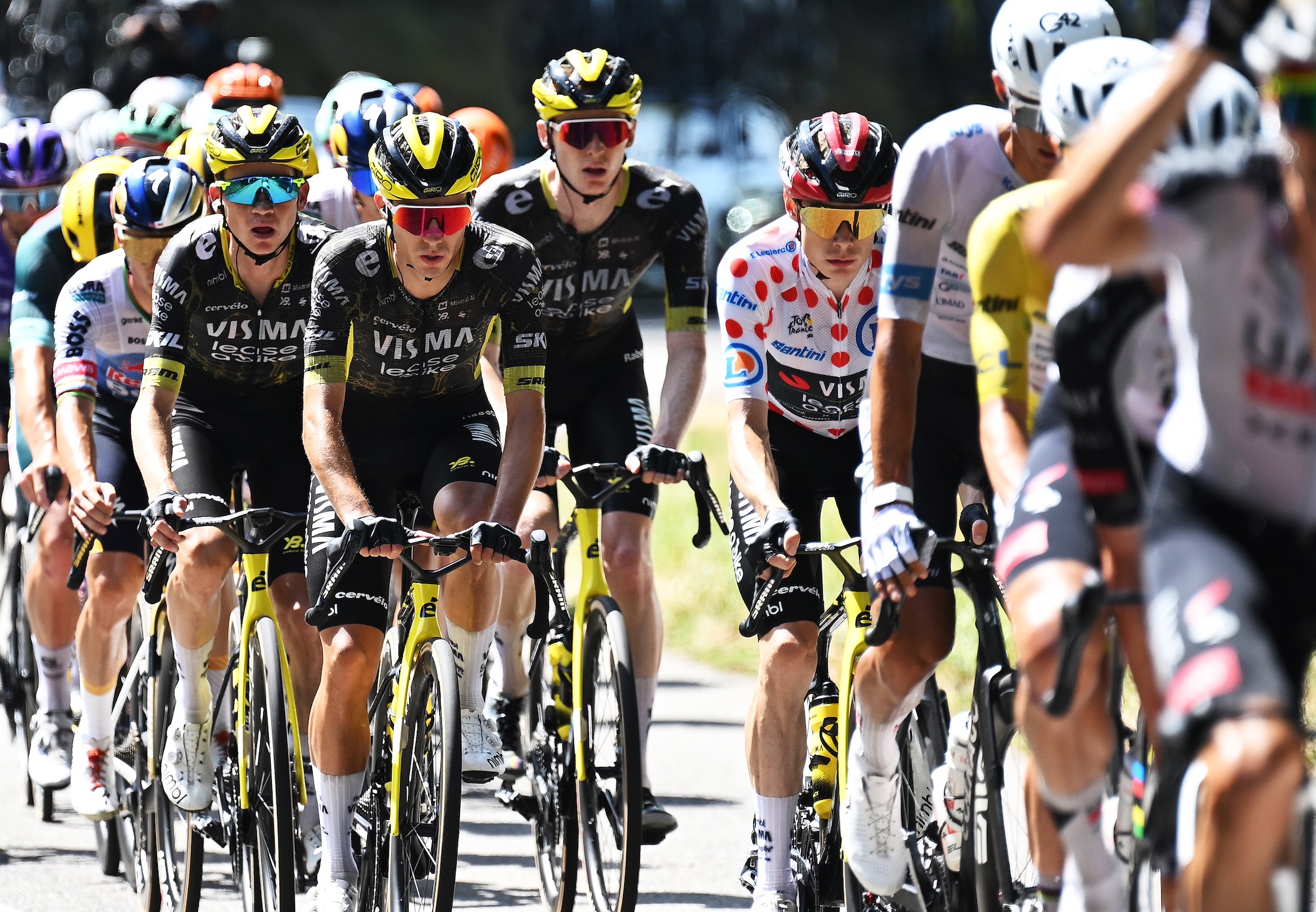 Visma-Lease a Bike riders (L-R) Sepp Kuss, Matteo Jorgenson rider behind team leader Jonas Vingegaard, in the Polka Dot Mountain Jersey on stage 9 of the Tour de France