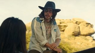 Austin Butler in a white open shirt and cowboy hat, sitting on a horse, as Tex in Once Upon a Time in Hollywood. 