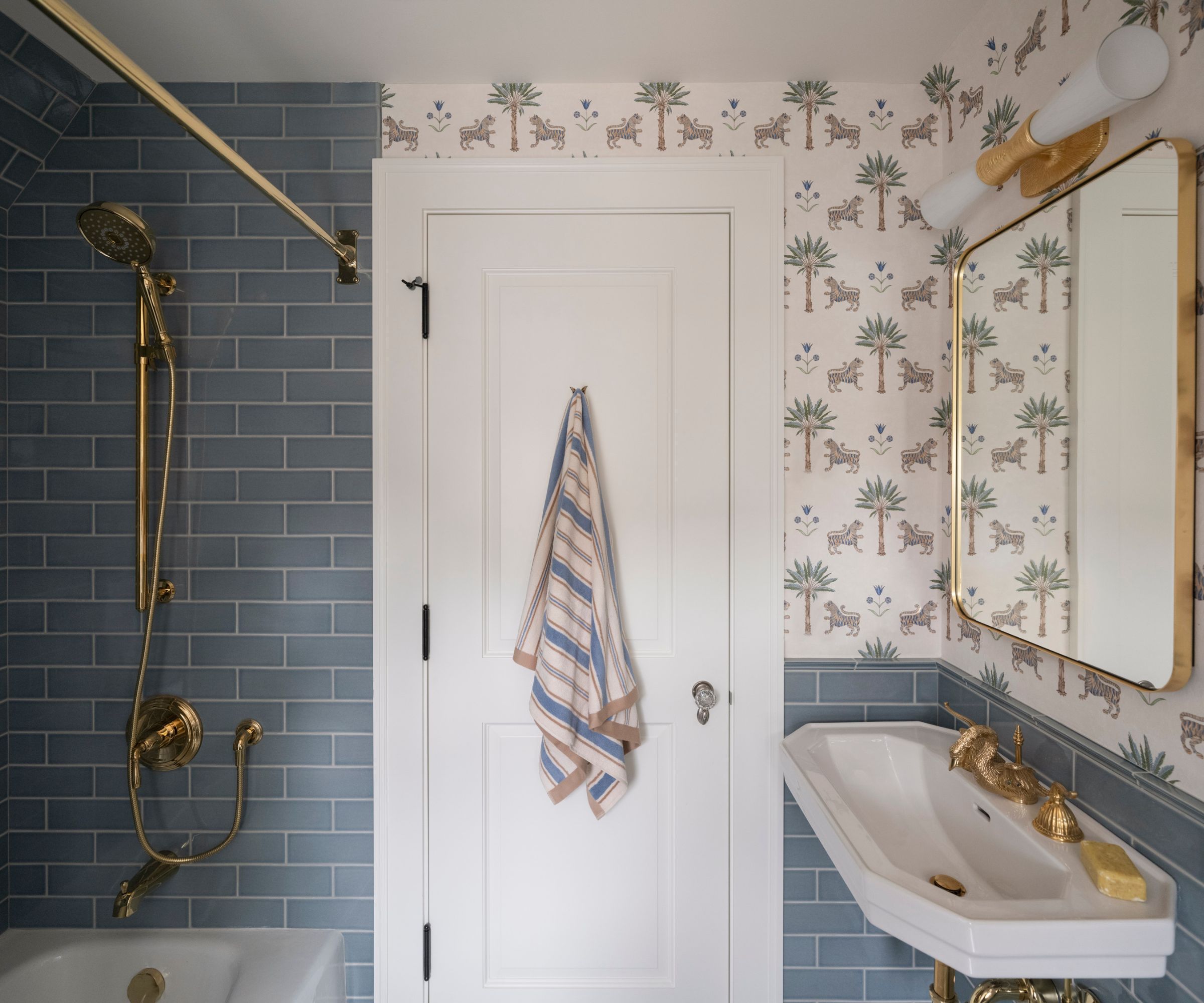 bathroom wallpaper and blue metro tiles