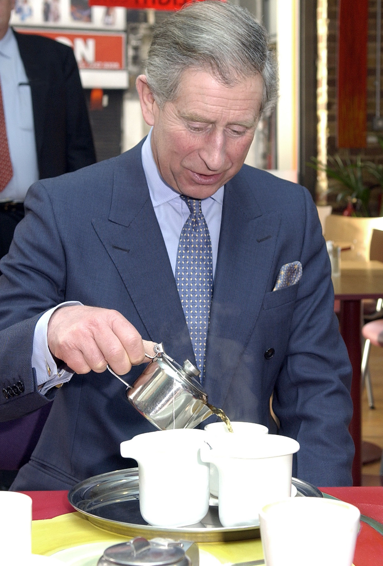 Prince Charles pouring tea