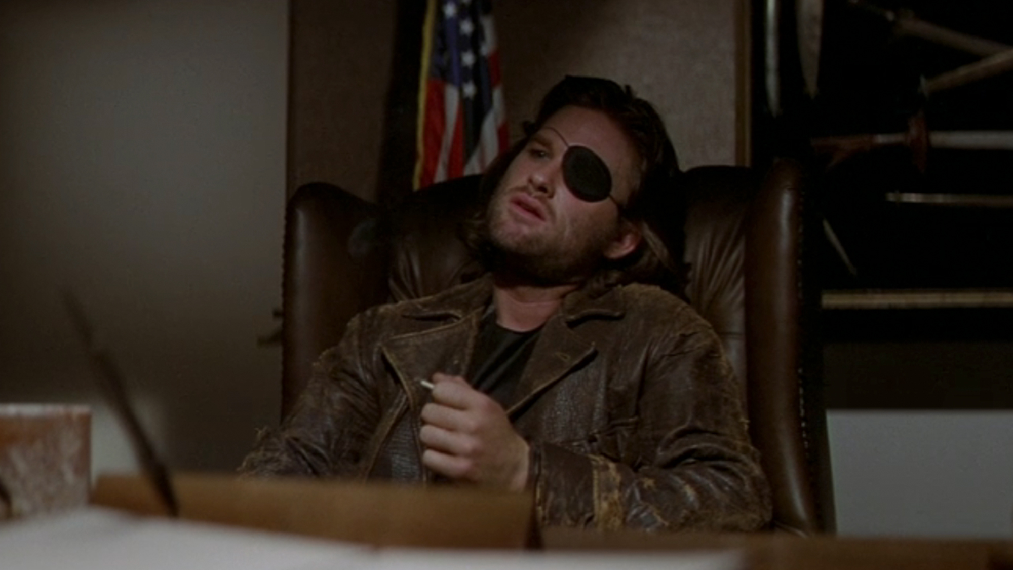Kurt Russell with an eye patch and a leather jacket in Escape From New York