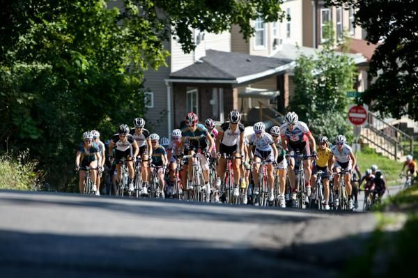 The women's field tackles a climb on the way out of town.