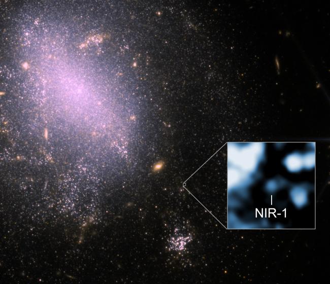a wispy white cloud among a starry background