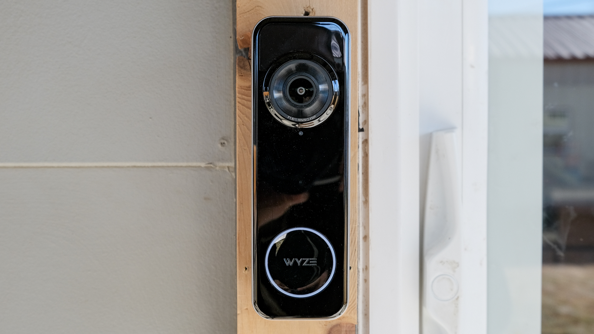 A Wyze Battery Video Doorbell mounted on a door frame