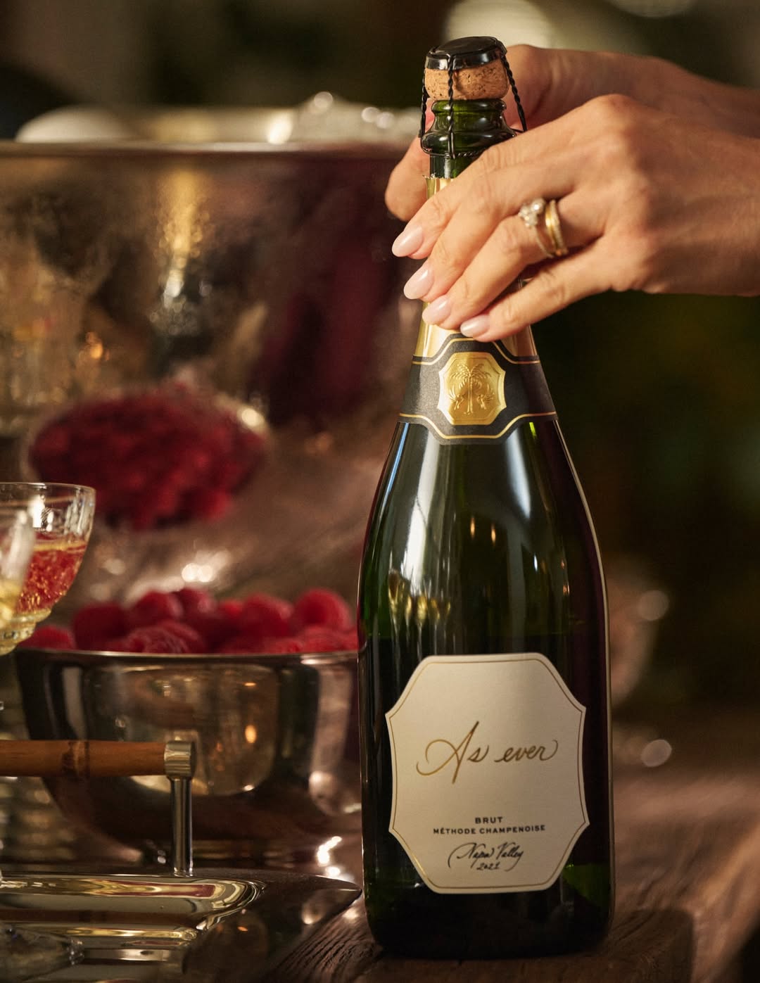 Meghan Markle wears a deep red burgundy dress with black straps and offers her take on the celeb-beloved slip dress trend in Heidi Merrick