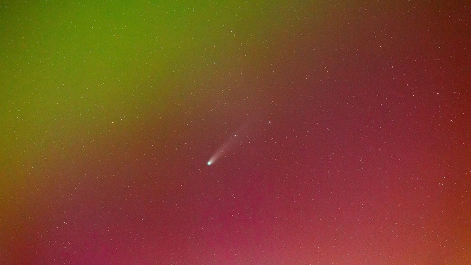 Unbelievable: Comet Lemmon Dazzles Over Scotland Amidst Vibrant Auroras!
