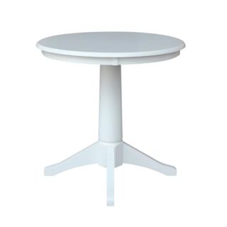 A white pedestal dining table