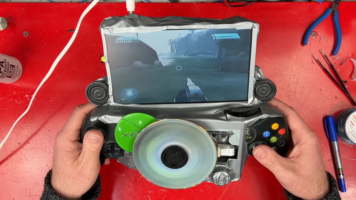 Modder takes hacksaw and hot glue to original Xbox to create a gaming handheld — ‘portable monstrosity’ has exposed spinning DVD in the center and plenty of duct tape, but works as intended