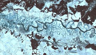This wintery landscape may look like the scene of an ancient, frosty river on Mars, but this image was taken by a satellite orbiting our own planet. The winding waterway flowing through this frame is the Dnieper River in Ukraine. It is the fourth-longest river in Europe, with a total length of about 1,400 miles (2,200 kilometers). NASA's Terra satellite captured this view of a portion of the Dnieper River near the Ukrainian city of Oster using its Advanced Spaceborne Thermal Emission and Reflection Radiometer (ASTER) instrument, which images Earth to map and monitor the changing surface of our planet.
