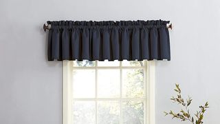 Sun Zero navy blue valance over ivory window frame