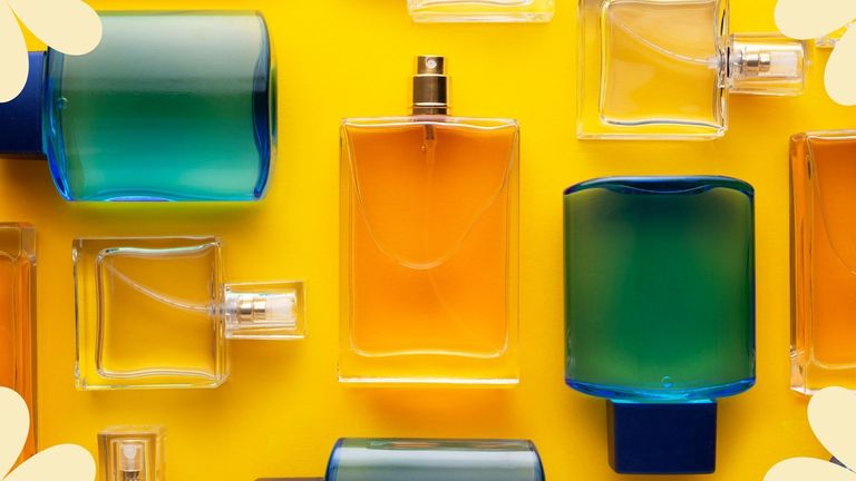 Several bottles of perfume with different perfume notes and ingredients on a yellow backdrop