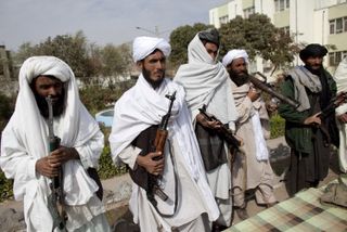 Surrendering Taliban insurgents pictured in 2004