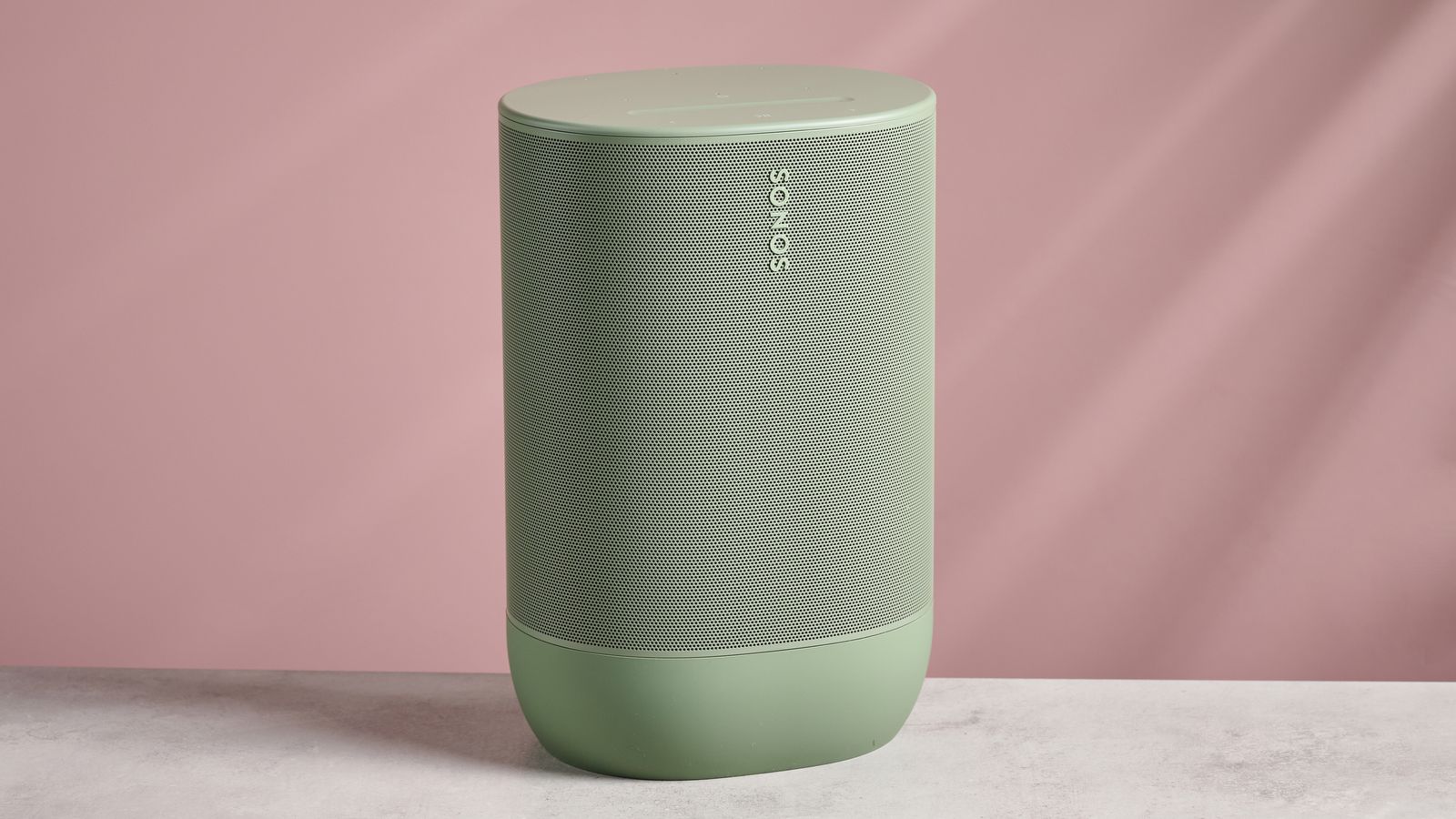 The front of the Sonos Move 2 in front of a pink background.