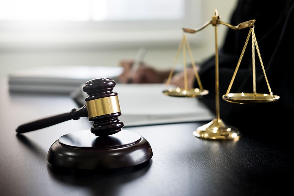Justice Scales and books and wooden gavel