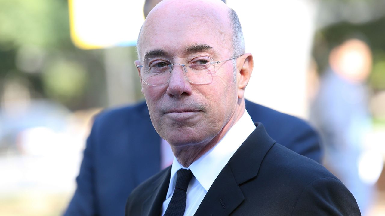 David Geffen looks off-camera outside the UCLA.