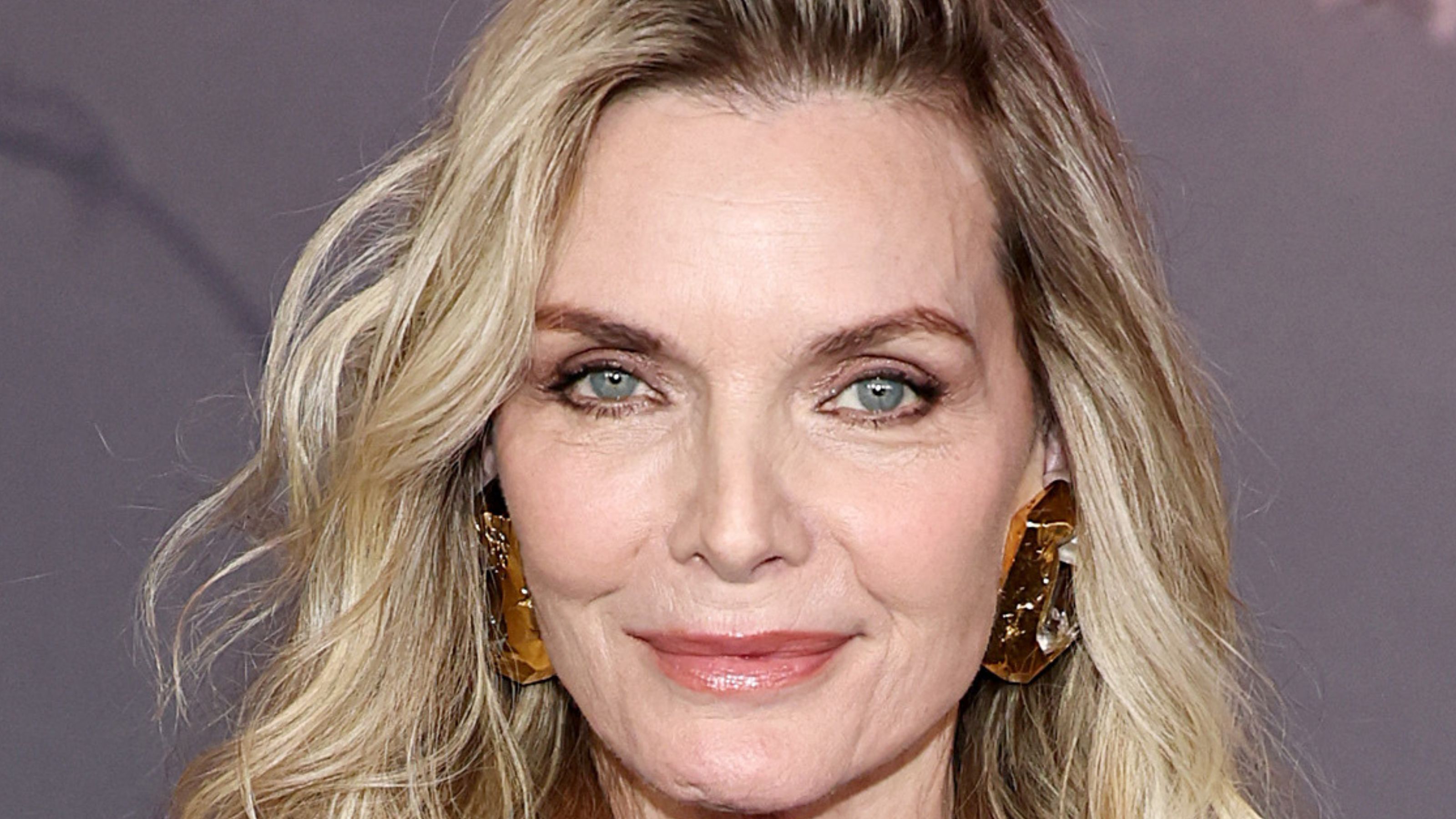 michelle pfeiffer on a gray background