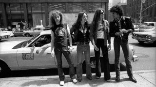 Thin Lizzy standing in front of a car in New York