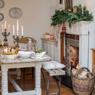 vintage style christmas dining room with wooden benches and table, decorated mantelpiece