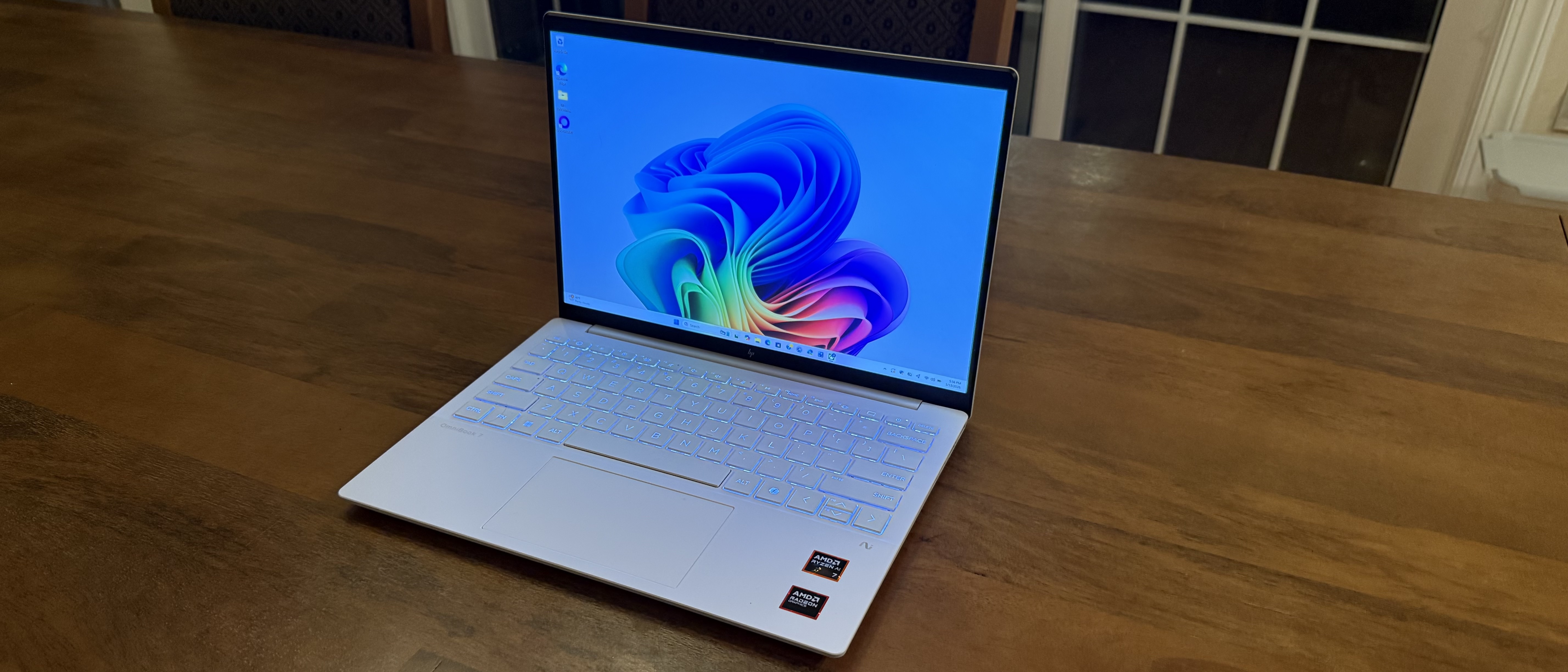 HP OmniBook 7 Aero laptop on a wooden desk