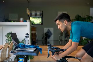 Male cyclist riding indoors